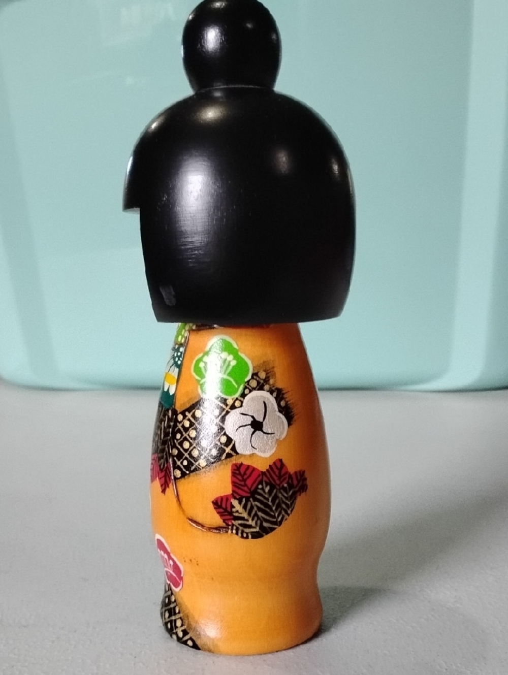 Hand-Painted Wooden Orange Kokeshi Doll with Black Hair - Classic Japanese Style - Picture 6 of 7